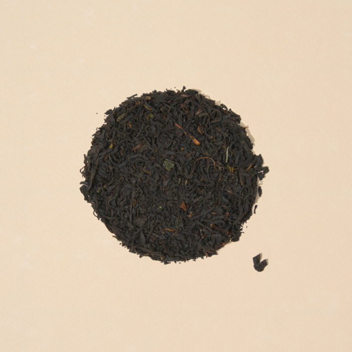 Saitama black tea leaves arranged inside a filled circle